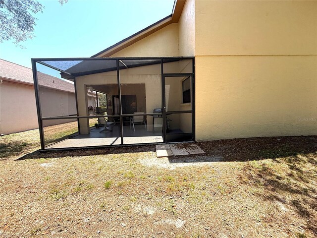 9311 Haas Dr, Hudson, FL 34669 - back of property featuring a patio area and stucco siding