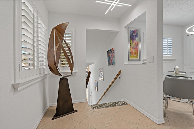 2026 Golfview Dr Unit 2026, Tarpon Springs, FL 34689 - stairs featuring plenty of natural light, baseboards, and tile patterned floors