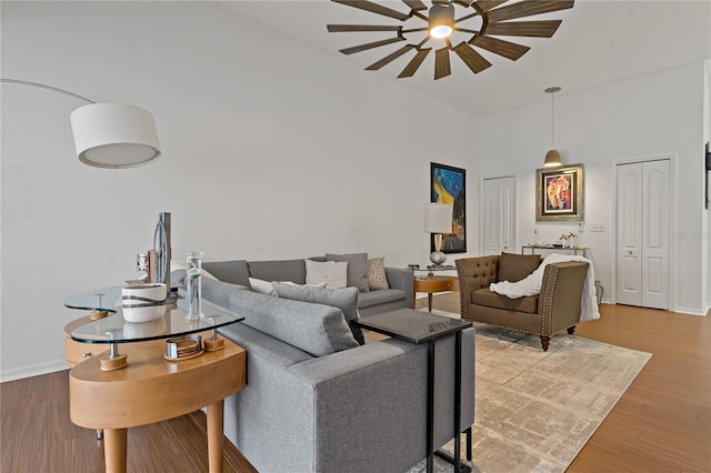 2026 Golfview Dr Unit 2026, Tarpon Springs, FL 34689 - living room featuring ceiling fan, high vaulted ceiling, wood finished floors, and baseboards