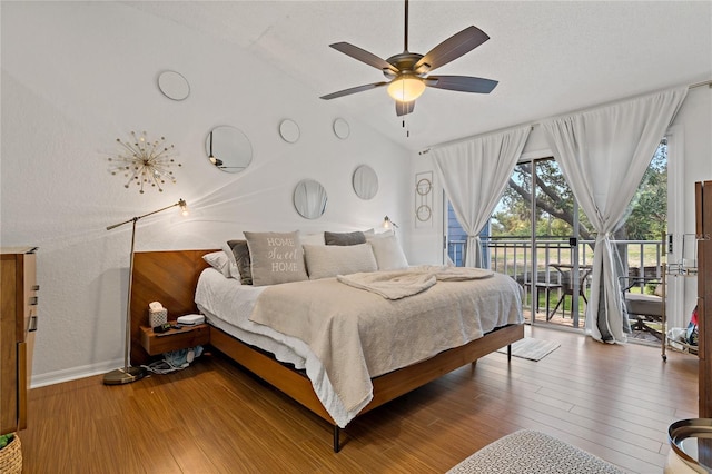 2026 Golfview Dr Unit 2026, Tarpon Springs, FL 34689 - bedroom featuring vaulted ceiling, access to outside, wood finished floors, baseboards, and a ceiling fan