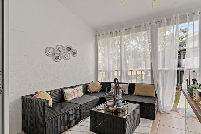 2026 Golfview Dr Unit 2026, Tarpon Springs, FL 34689 - sunroom with a textured wall, ornamental molding, outdoor lounge area, tile patterned floors, and a ceiling fan