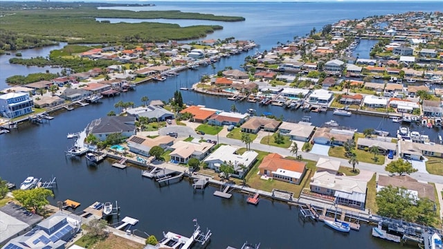 aerial view of residential area with a nearby body of water