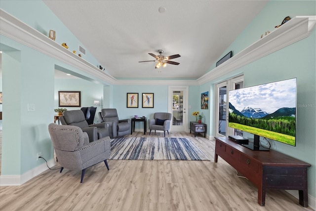 living room featuring wood finished floors, a ceiling fan, high vaulted ceiling, and baseboards