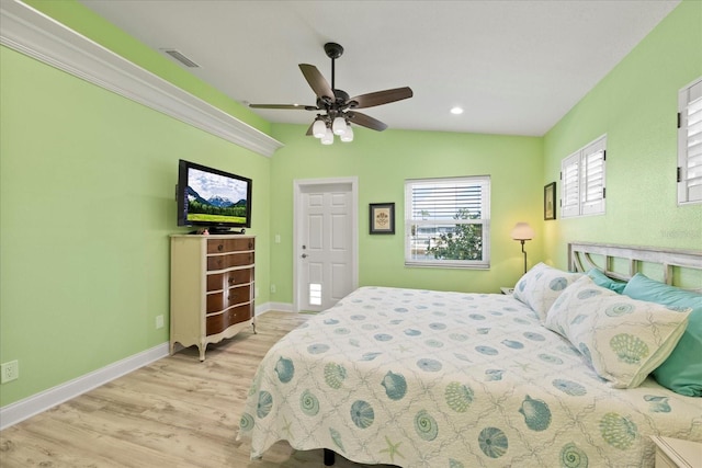 bedroom featuring wood finished floors, baseboards, recessed lighting, and a ceiling fan