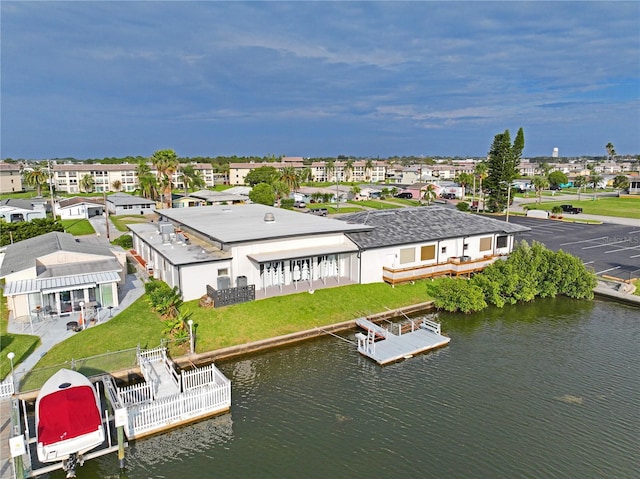aerial perspective of suburban area with a large body of water