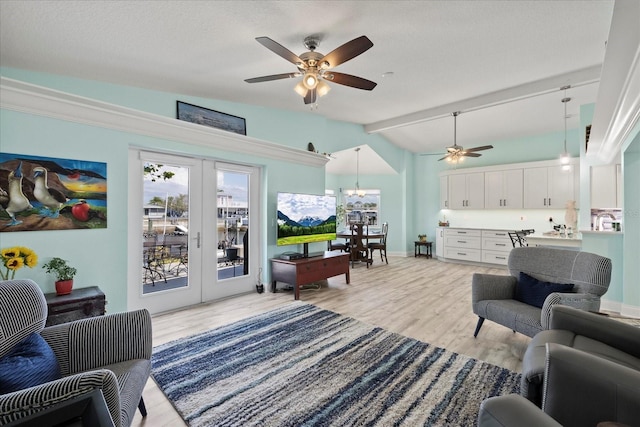 living room featuring french doors, ceiling fan, light wood-style floors, and baseboards