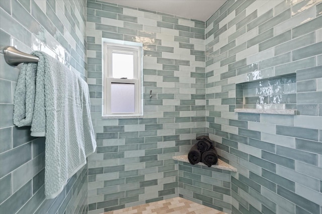 full bathroom featuring tiled shower
