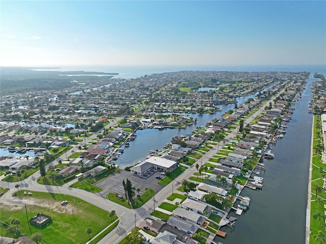 view of property location with a nearby body of water and nearby suburban area