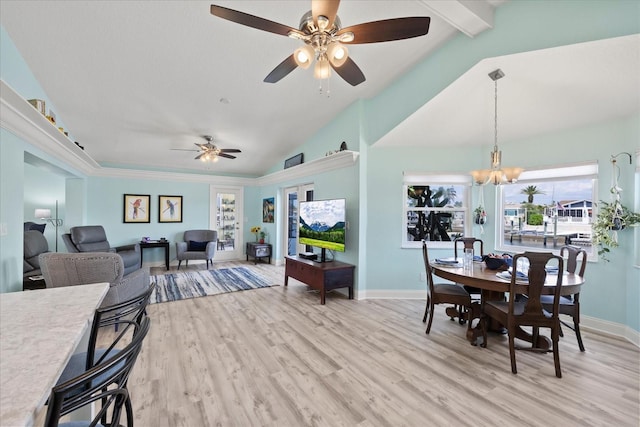 4918 Forecastle Dr, New Port Richey, FL 34652 - dining room featuring a ceiling fan, light wood finished floors, and a chandelier
