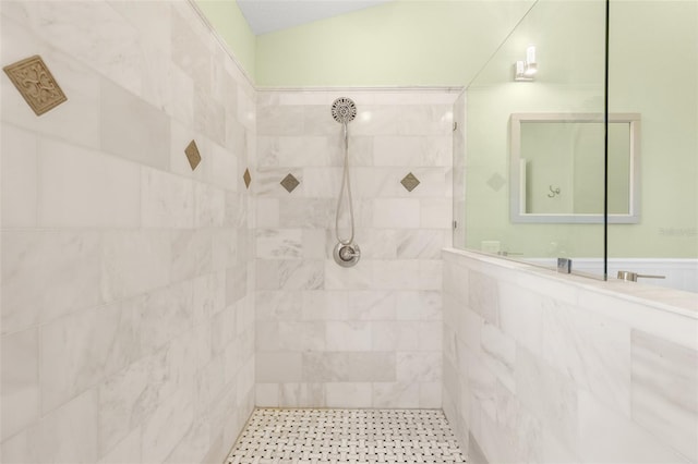 bathroom with tiled shower