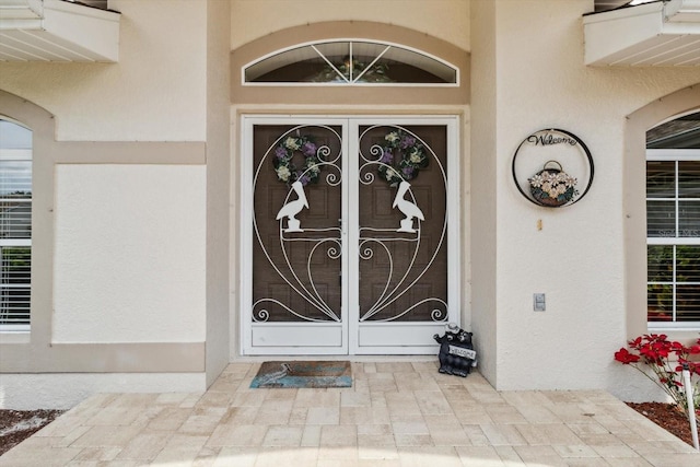 3773 E Lake Todd Dr, Hernando, FL 34442 - doorway to property with french doors and stucco siding