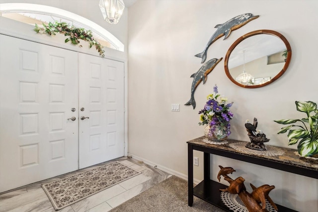 3773 E Lake Todd Dr, Hernando, FL 34442 - foyer entrance featuring a chandelier and baseboards