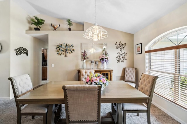 3773 E Lake Todd Dr, Hernando, FL 34442 - carpeted dining room with a chandelier, lofted ceiling, and baseboards