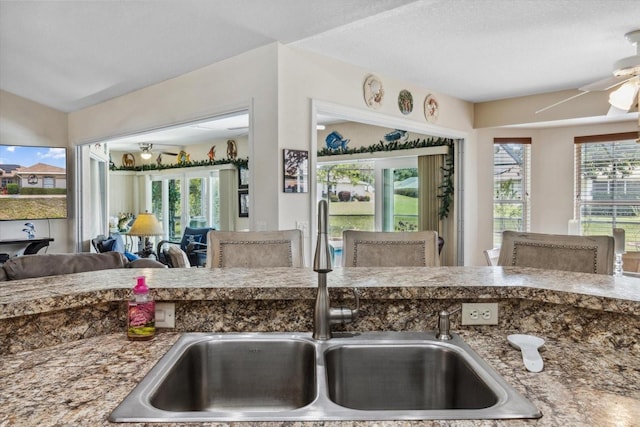 3773 E Lake Todd Dr, Hernando, FL 34442 - kitchen featuring a ceiling fan, a sink, healthy amount of natural light, open floor plan, and lofted ceiling