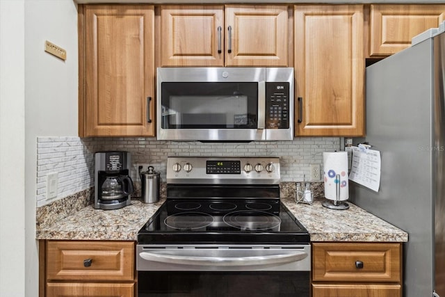 3773 E Lake Todd Dr, Hernando, FL 34442 - kitchen with stainless steel appliances, decorative backsplash, and light stone countertops