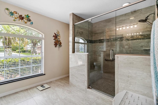 3773 E Lake Todd Dr, Hernando, FL 34442 - full bathroom with a shower stall, baseboards, and marble look tile flooring