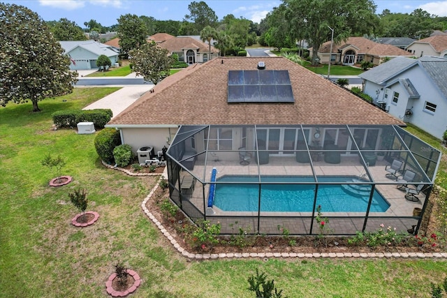 3773 E Lake Todd Dr, Hernando, FL 34442 - back of house featuring a patio, solar panels, a yard, a residential view, and glass enclosure