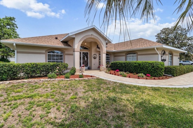 3773 E Lake Todd Dr, Hernando, FL 34442 - mediterranean / spanish-style home with stucco siding and a front yard