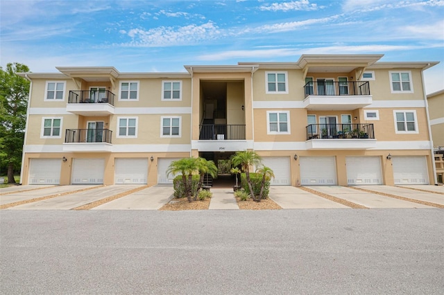 5041 Royal Palms Way Unit 203, New Port Richey, FL 34652 - view of property featuring a garage
