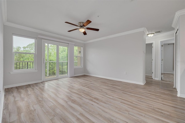 5041 Royal Palms Way Unit 203, New Port Richey, FL 34652 - unfurnished room featuring ceiling fan, healthy amount of natural light, baseboards, and crown molding