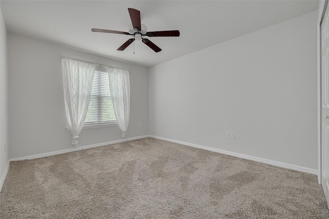 5041 Royal Palms Way Unit 203, New Port Richey, FL 34652 - carpeted empty room featuring baseboards and a ceiling fan
