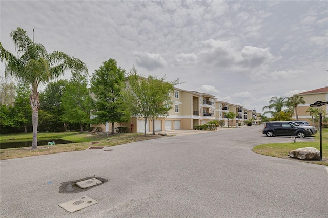 5041 Royal Palms Way Unit 203, New Port Richey, FL 34652 - view of asphalt road featuring a residential view