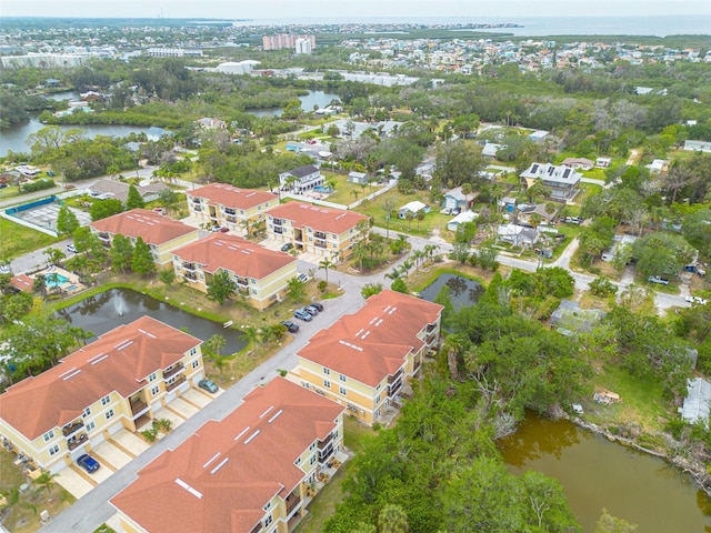 5041 Royal Palms Way Unit 203, New Port Richey, FL 34652 - aerial view of property and surrounding area with a large body of water and nearby suburban area