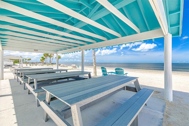 5041 Royal Palms Way Unit 203, New Port Richey, FL 34652 - view of patio featuring view of water and beach