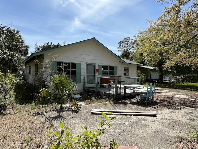 1226 Hawthorne Ave, Cedar Key, FL 32625 - back of house with a deck
