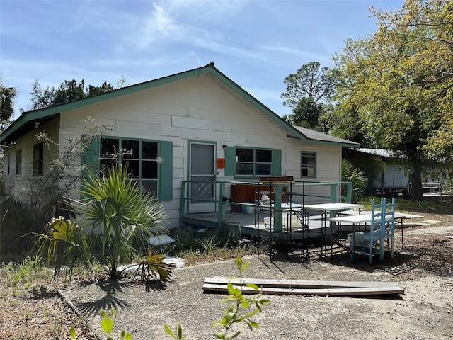1226 Hawthorne Ave, Cedar Key, FL 32625 - rear view of property featuring a deck