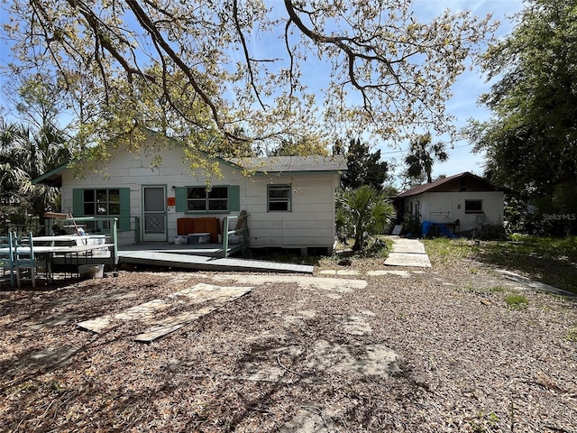 1226 Hawthorne Ave, Cedar Key, FL 32625 - rear view of property with a wooden deck