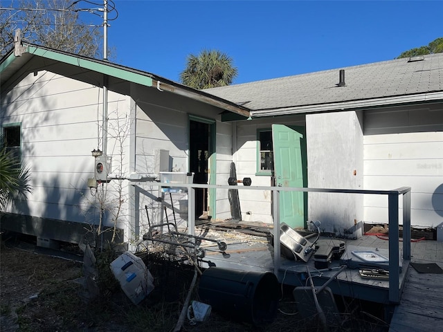 1226 Hawthorne Ave, Cedar Key, FL 32625 - doorway to property featuring roof with shingles