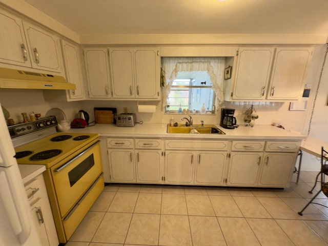 kitchen with white electric range, a sink, under cabinet range hood, light countertops, and light tile patterned floors