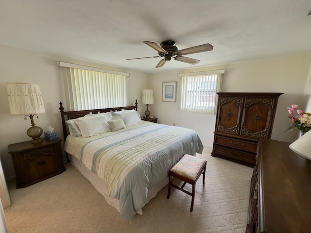 bedroom with light colored carpet and ceiling fan