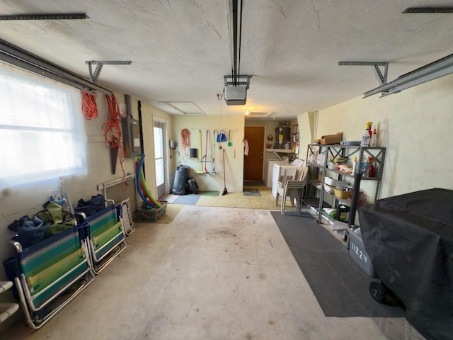 garage featuring a garage door opener and electric panel