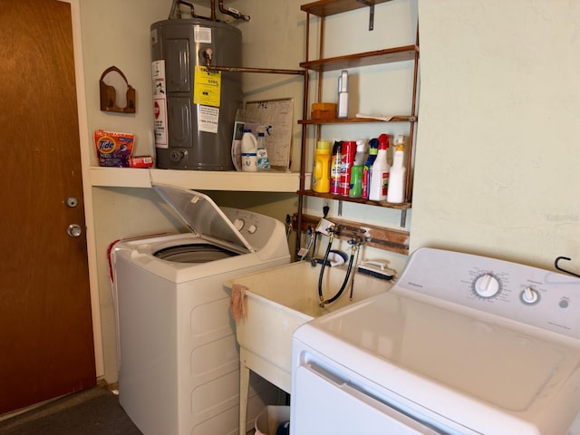 laundry area with electric water heater and independent washer and dryer