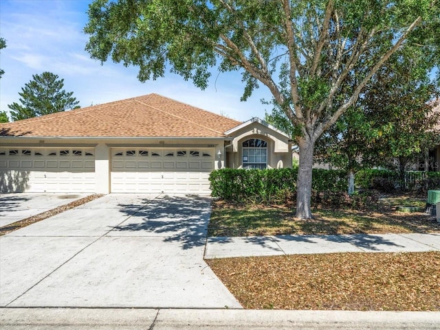 3885 Crossline Dr, Spring Hill, FL 34609 - single story home featuring driveway, an attached garage, stucco siding, and a shingled roof