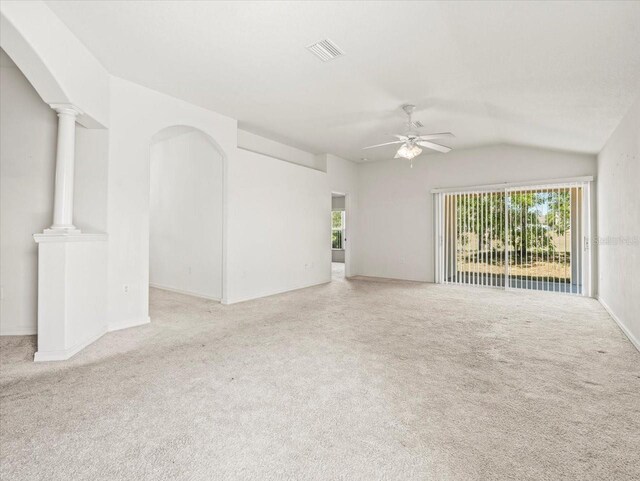 3885 Crossline Dr, Spring Hill, FL 34609 - unfurnished living room featuring carpet flooring, ceiling fan, vaulted ceiling, and baseboards