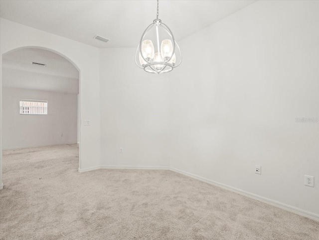 3885 Crossline Dr, Spring Hill, FL 34609 - empty room featuring arched walkways, a chandelier, carpet flooring, and baseboards