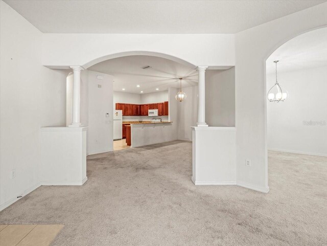 3885 Crossline Dr, Spring Hill, FL 34609 - unfurnished living room with light carpet, recessed lighting, baseboards, and arched walkways