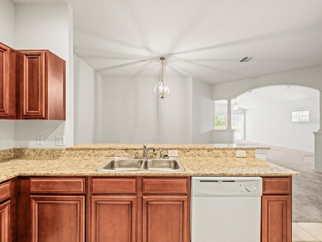 3885 Crossline Dr, Spring Hill, FL 34609 - kitchen featuring dishwasher, a sink, arched walkways, light colored carpet, and light stone countertops