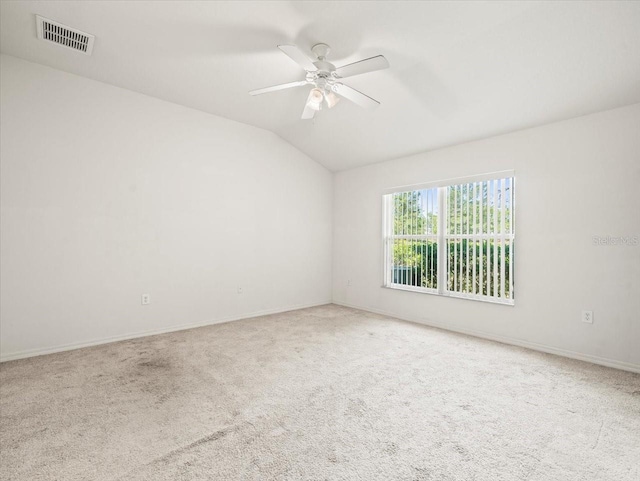 3885 Crossline Dr, Spring Hill, FL 34609 - carpeted spare room featuring lofted ceiling, ceiling fan, and baseboards
