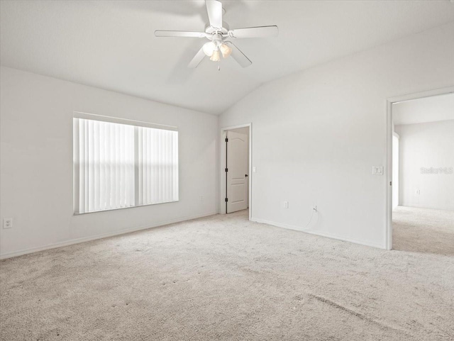 3885 Crossline Dr, Spring Hill, FL 34609 - empty room featuring carpet, ceiling fan, lofted ceiling, and baseboards