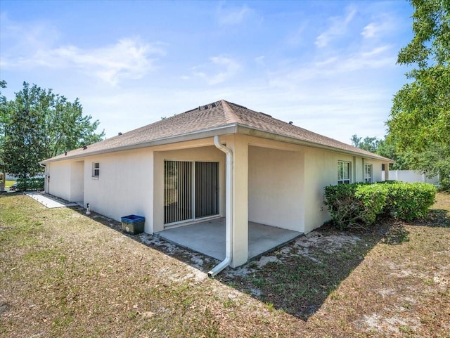 3885 Crossline Dr, Spring Hill, FL 34609 - rear view of property with a patio area and stucco siding