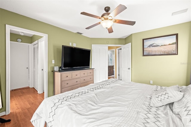 bedroom featuring wood finished floors and a ceiling fan