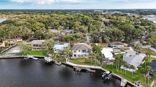 aerial perspective of suburban area featuring a nearby body of water
