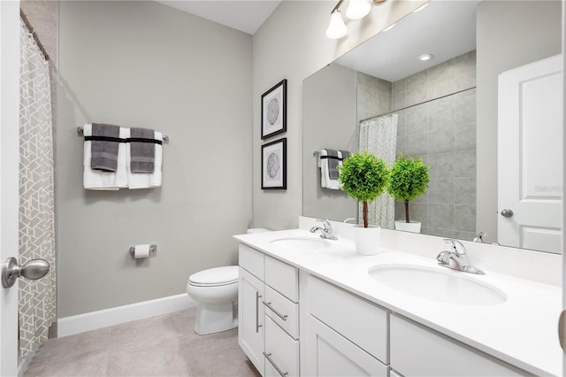 2193 Aibonito Cir, Clermont, FL 34711 - full bath with double vanity, toilet, tile patterned floors, baseboards, and a shower with shower curtain