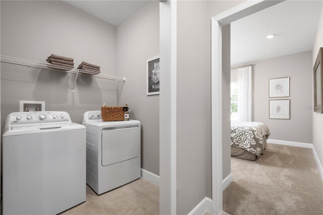 2193 Aibonito Cir, Clermont, FL 34711 - washroom with washing machine and dryer and baseboards
