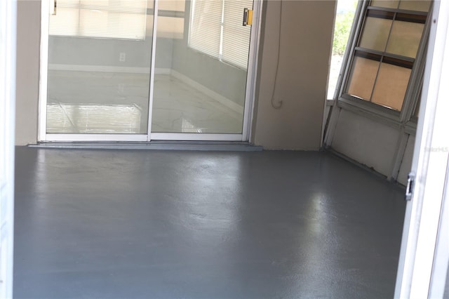 spare room with finished concrete floors
