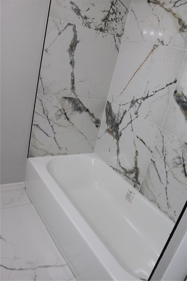 detailed view of a tub and baseboards